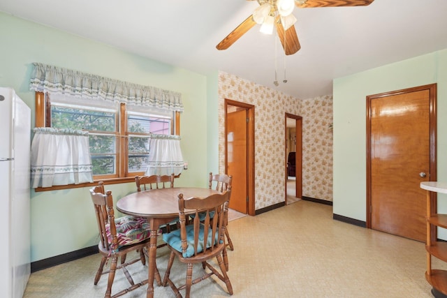 4518 Colfax Ave N, Minneapolis, MN 55412 - dining space featuring baseboards, light flooring, a ceiling fan, and wallpapered walls