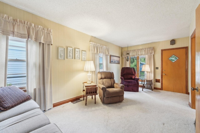 4518 Colfax Ave N, Minneapolis, MN 55412 - carpeted living room with a textured ceiling and baseboards