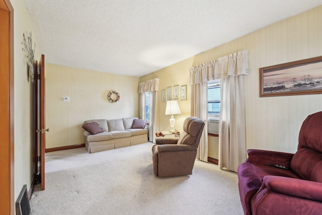 4518 Colfax Ave N, Minneapolis, MN 55412 - carpeted living room with a textured ceiling, baseboards, and wallpapered walls
