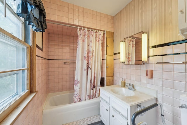 4518 Colfax Ave N, Minneapolis, MN 55412 - full bath with tile walls, shower / bath combination with curtain, and vanity