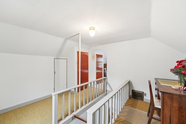 4518 Colfax Ave N, Minneapolis, MN 55412 - additional living space with vaulted ceiling, arched walkways, and baseboards