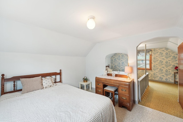 4518 Colfax Ave N, Minneapolis, MN 55412 - bedroom with light colored carpet, lofted ceiling, and arched walkways