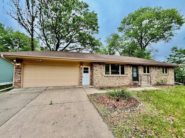 25 103rd Ave NW, Coon Rapids, MN 55448 - ranch-style home with an attached garage, driveway, and brick siding