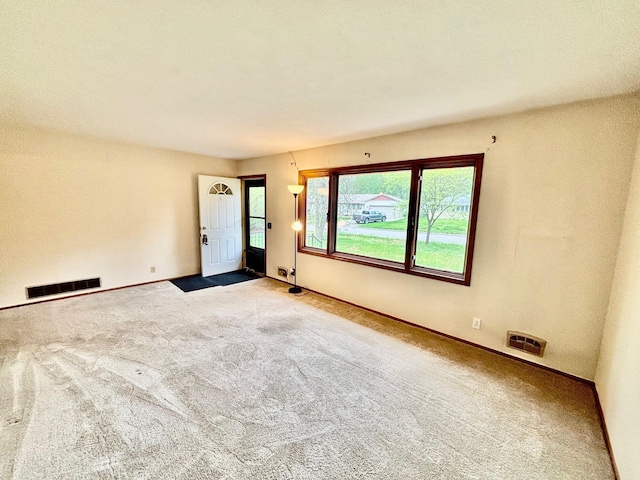 25 103rd Ave NW, Coon Rapids, MN 55448 - carpeted empty room with baseboards
