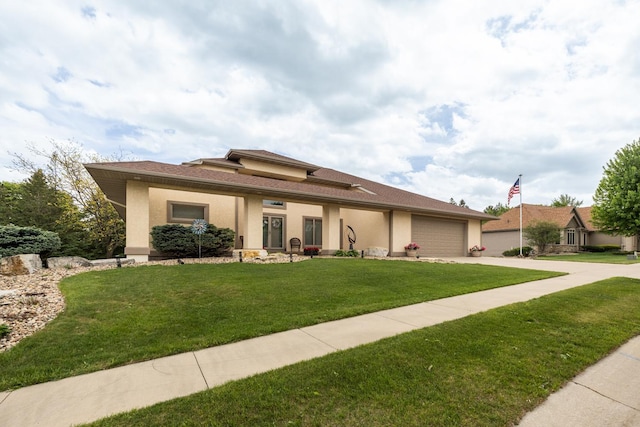 2592 Aspen Pl SW, Rochester, MN 55902 - view of front of property featuring concrete driveway, an attached garage, a front yard, and stucco siding