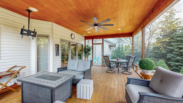 2592 Aspen Pl SW, Rochester, MN 55902 - wooden terrace with outdoor dining space, outdoor lounge area, and ceiling fan