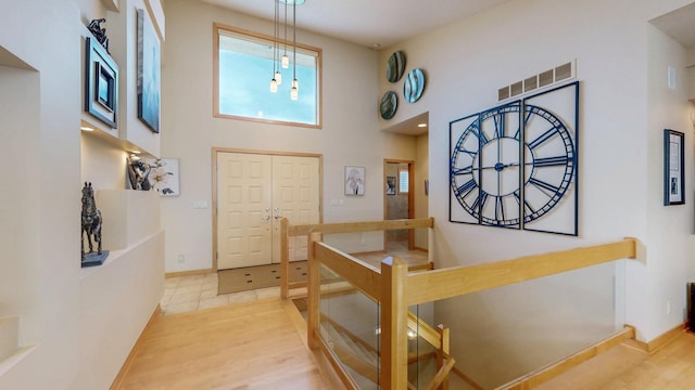 2592 Aspen Pl SW, Rochester, MN 55902 - foyer entrance featuring a high ceiling, light wood-style floors, and baseboards