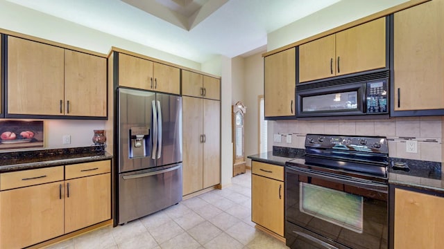 2592 Aspen Pl SW, Rochester, MN 55902 - kitchen featuring black appliances, dark stone counters, and decorative backsplash
