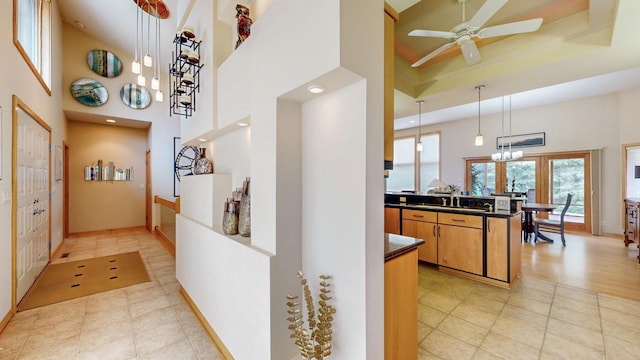 2592 Aspen Pl SW, Rochester, MN 55902 - hall featuring a high ceiling, a sink, a chandelier, recessed lighting, and baseboards