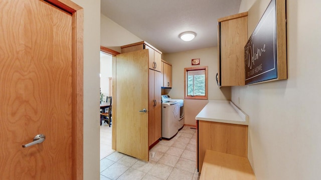 2592 Aspen Pl SW, Rochester, MN 55902 - laundry room featuring washer and dryer, cabinet space, and light tile patterned floors