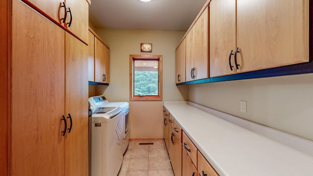 2592 Aspen Pl SW, Rochester, MN 55902 - washroom with separate washer and dryer, cabinet space, baseboards, and light tile patterned floors