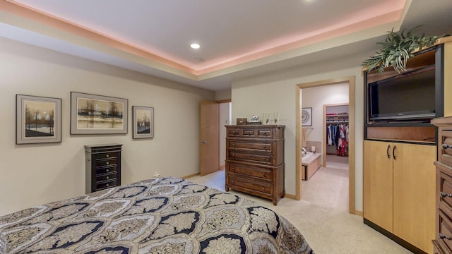 2592 Aspen Pl SW, Rochester, MN 55902 - bedroom with light carpet, a spacious closet, recessed lighting, a tray ceiling, and a closet