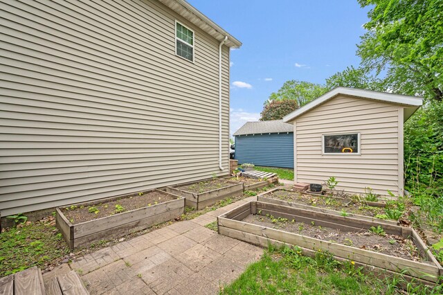 114 3rd Ave E, Truman, MN 56088 - view of patio / terrace featuring a garden