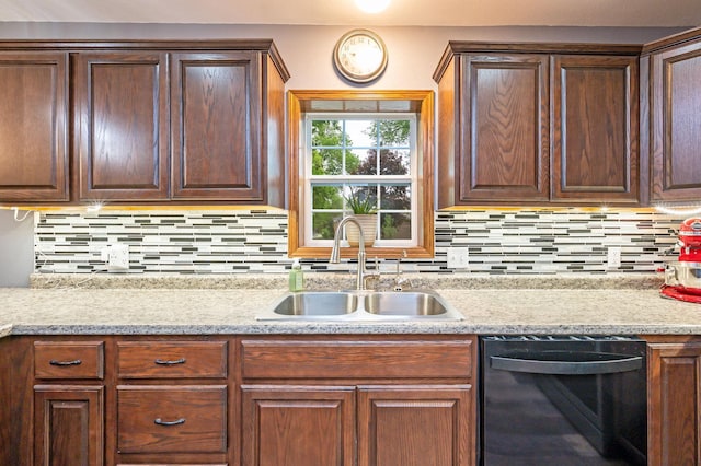 114 3rd Ave E, Truman, MN 56088 - kitchen with black dishwasher, a sink, and decorative backsplash