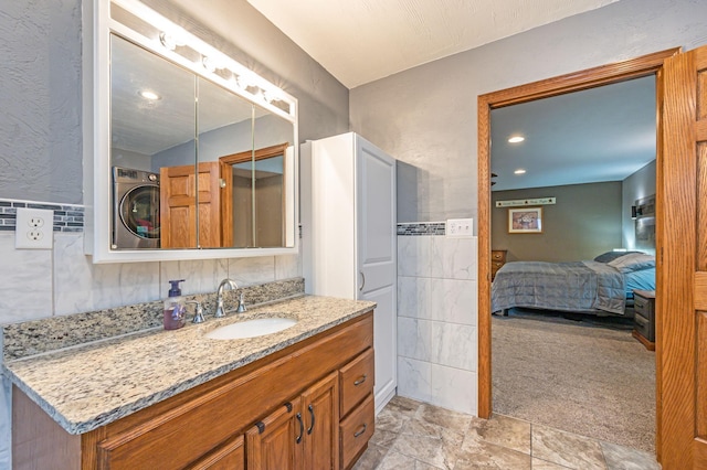 114 3rd Ave E, Truman, MN 56088 - ensuite bathroom with vanity and tile walls