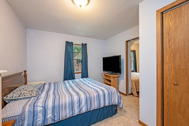 114 3rd Ave E, Truman, MN 56088 - carpeted bedroom featuring baseboards