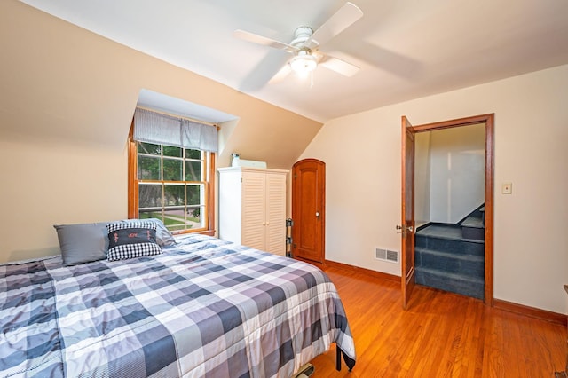 114 3rd Ave E, Truman, MN 56088 - bedroom featuring baseboards, wood finished floors, and a ceiling fan