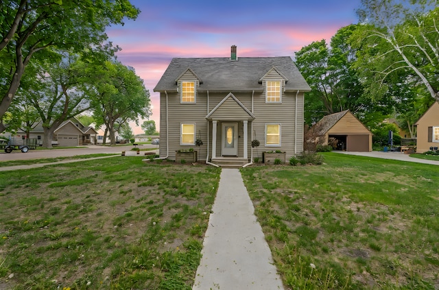 114 3rd Ave E, Truman, MN 56088 - view of front of property featuring a garage, a yard, and a chimney