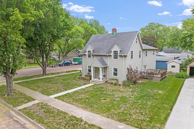 114 3rd Ave E, Truman, MN 56088 - view of front of property with a chimney, a front yard, and a shingled roof