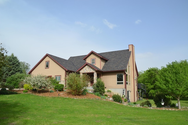 W11085 470th Ave, Oak Grove Twp, WI 54021 - view of front facade with a front yard, a chimney, and stone siding