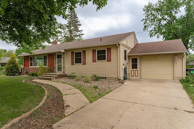 724 16th St NE, Rochester, MN 55906 - single story home with a chimney, a garage, concrete driveway, and a front lawn