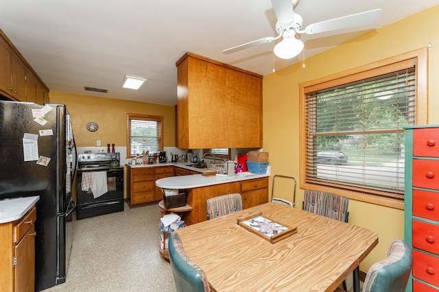 724 16th St NE, Rochester, MN 55906 - kitchen featuring black appliances, brown cabinets, ceiling fan, and light countertops