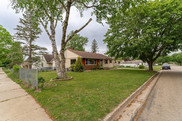 724 16th St NE, Rochester, MN 55906 - view of front of house featuring a chimney and brick siding