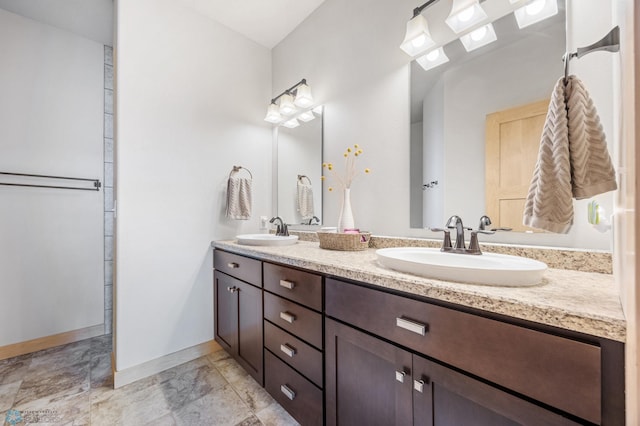405 12th St NE, Dilworth, MN 56529 - bathroom with double vanity and baseboards