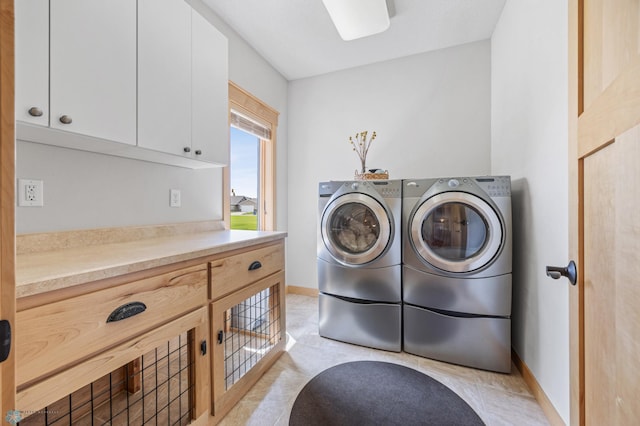405 12th St NE, Dilworth, MN 56529 - washroom featuring washing machine and clothes dryer, cabinet space, and baseboards