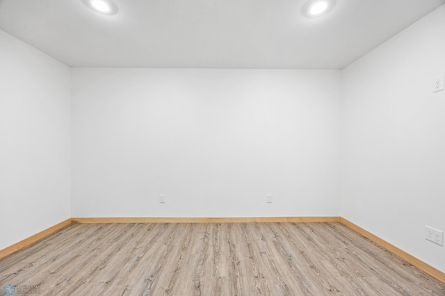 405 12th St NE, Dilworth, MN 56529 - unfurnished room featuring wood finished floors, baseboards, and recessed lighting