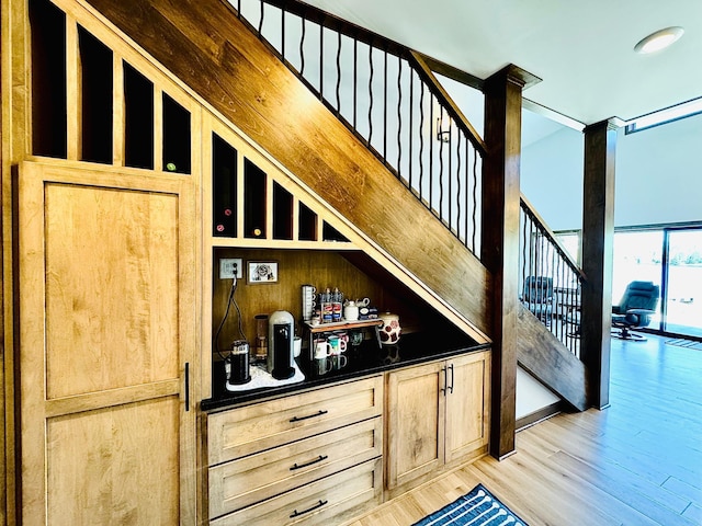 30710 County Road 45, Marcell Twp, MN 56628 - bar area featuring light wood-style floors and stairway