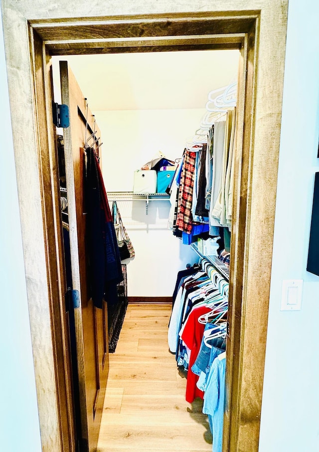 30710 County Road 45, Marcell Twp, MN 56628 - walk in closet featuring wood finished floors