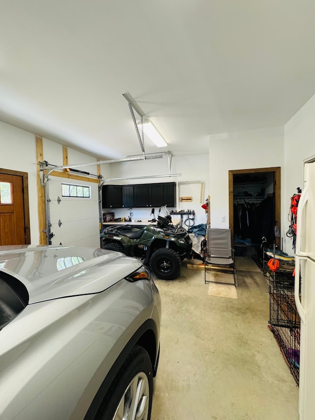 30710 County Road 45, Marcell Twp, MN 56628 - garage featuring freestanding refrigerator