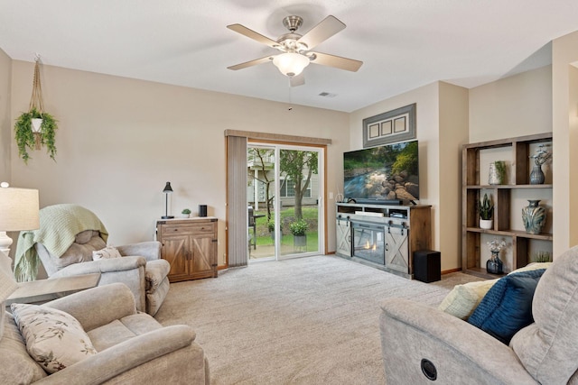 13900 Garnet Ter NW, Ramsey, MN 55303 - carpeted living room featuring ceiling fan and a glass covered fireplace