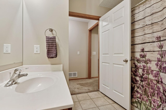 13900 Garnet Ter NW, Ramsey, MN 55303 - bathroom featuring vanity, tile patterned floors, and a shower with curtain