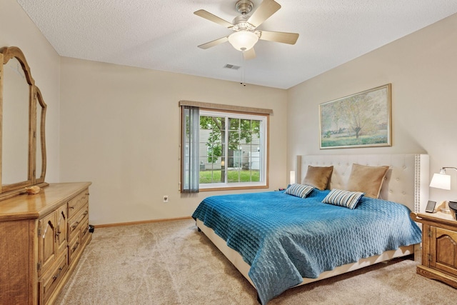 13900 Garnet Ter NW, Ramsey, MN 55303 - bedroom with light colored carpet, ceiling fan, and a textured ceiling