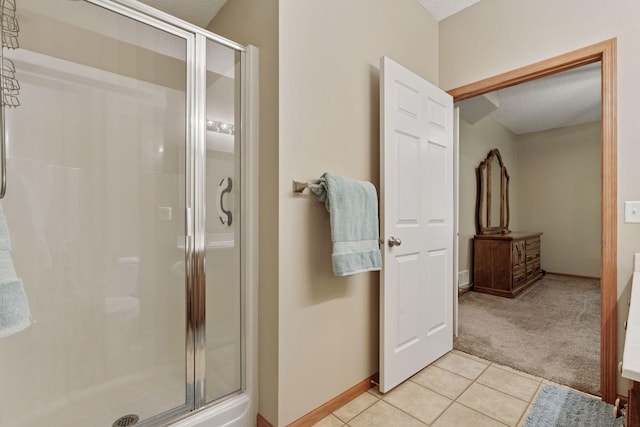 13900 Garnet Ter NW, Ramsey, MN 55303 - bathroom with a shower stall, a textured ceiling, and tile patterned flooring