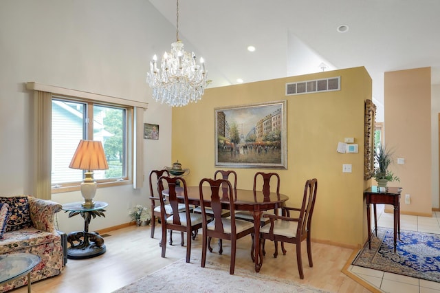 8207 Norman Creek Trl, Bloomington, MN 55437 - dining space with high vaulted ceiling, light wood-style flooring, a chandelier, baseboards, and recessed lighting