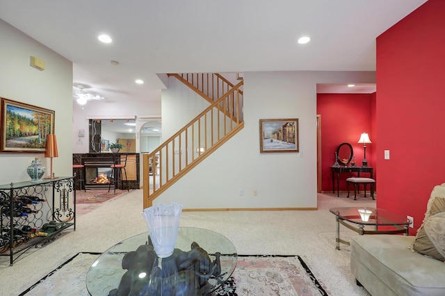 8207 Norman Creek Trl, Bloomington, MN 55437 - carpeted living room featuring stairs, recessed lighting, a multi sided fireplace, baseboards, and ceiling fan