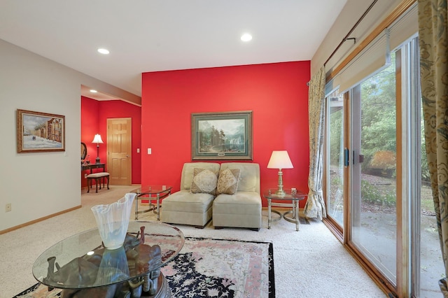 8207 Norman Creek Trl, Bloomington, MN 55437 - carpeted living area with an accent wall, recessed lighting, and baseboards