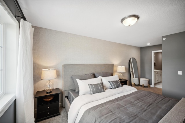 12730 8th Ave S, Zimmerman, MN 55398 - bedroom featuring carpet floors, ensuite bathroom, and an accent wall