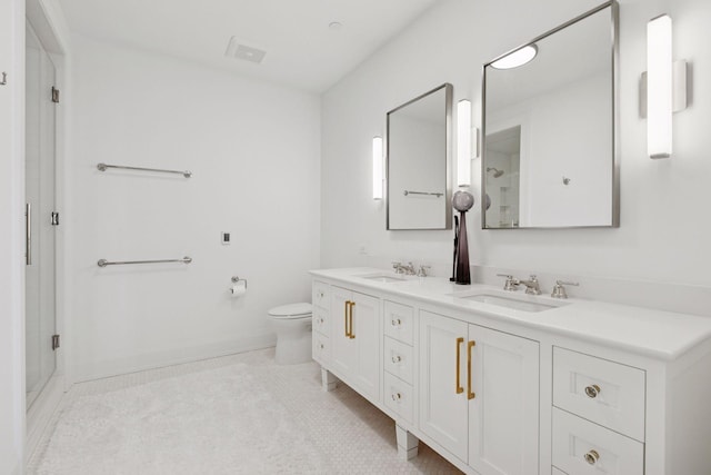 1111 River Pkwy Unit 24C, Minneapolis, MN 55415 - bathroom with a shower stall, double vanity, toilet, tile patterned flooring, and baseboards