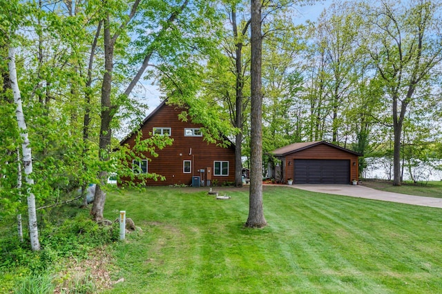 209 9 1/2 Ave, Turtle Lake, WI 54889 - view of front facade with an outdoor structure, a front lawn, and a detached garage