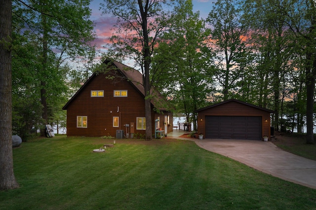 209 9 1/2 Ave, Turtle Lake, WI 54889 - view of front of house featuring an outbuilding, a front yard, a garage, and central air condition unit