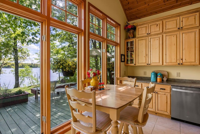 209 9 1/2 Ave, Turtle Lake, WI 54889 - dining area with vaulted ceiling, a water view, and light tile patterned flooring