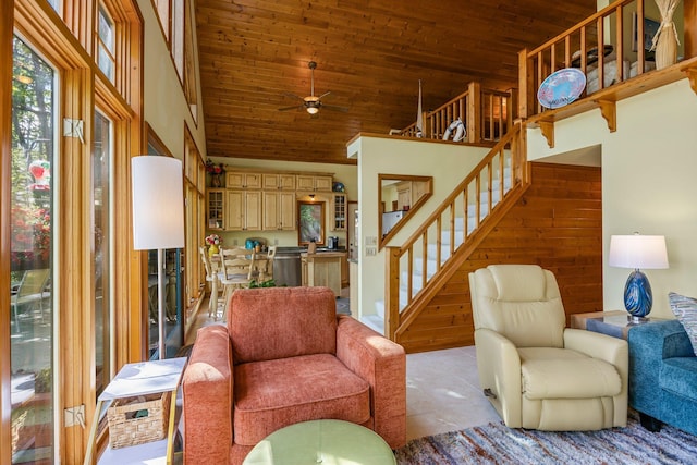 209 9 1/2 Ave, Turtle Lake, WI 54889 - living area with ceiling fan, wood ceiling, stairway, light tile patterned flooring, and high vaulted ceiling