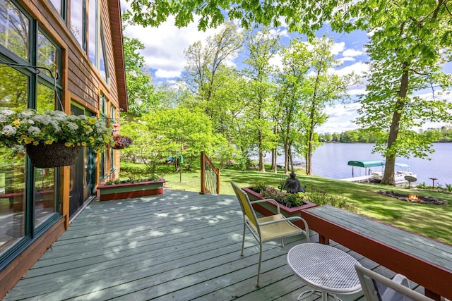 209 9 1/2 Ave, Turtle Lake, WI 54889 - wooden deck featuring a water view and a lawn