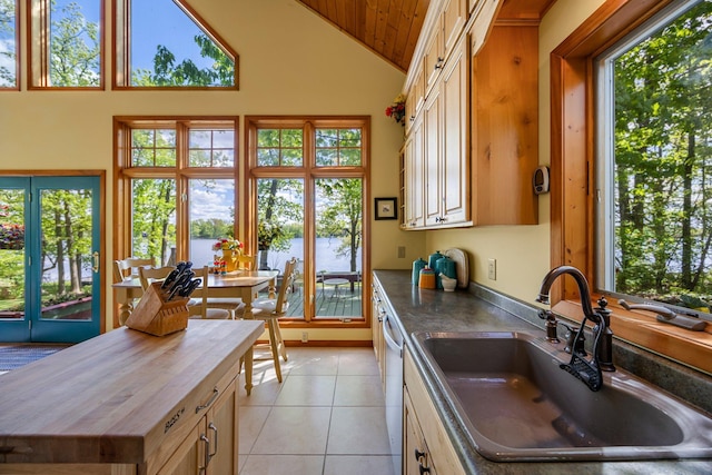 209 9 1/2 Ave, Turtle Lake, WI 54889 - kitchen with a sink, light tile patterned floors, a water view, high vaulted ceiling, and wooden ceiling