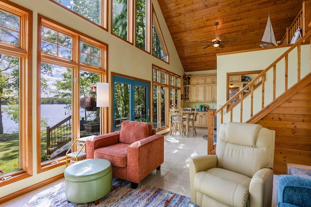 209 9 1/2 Ave, Turtle Lake, WI 54889 - living room with high vaulted ceiling, a water view, healthy amount of natural light, light tile patterned floors, and ceiling fan