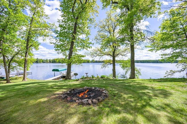 209 9 1/2 Ave, Turtle Lake, WI 54889 - view of grassy yard with a water view, a fire pit, and a dock